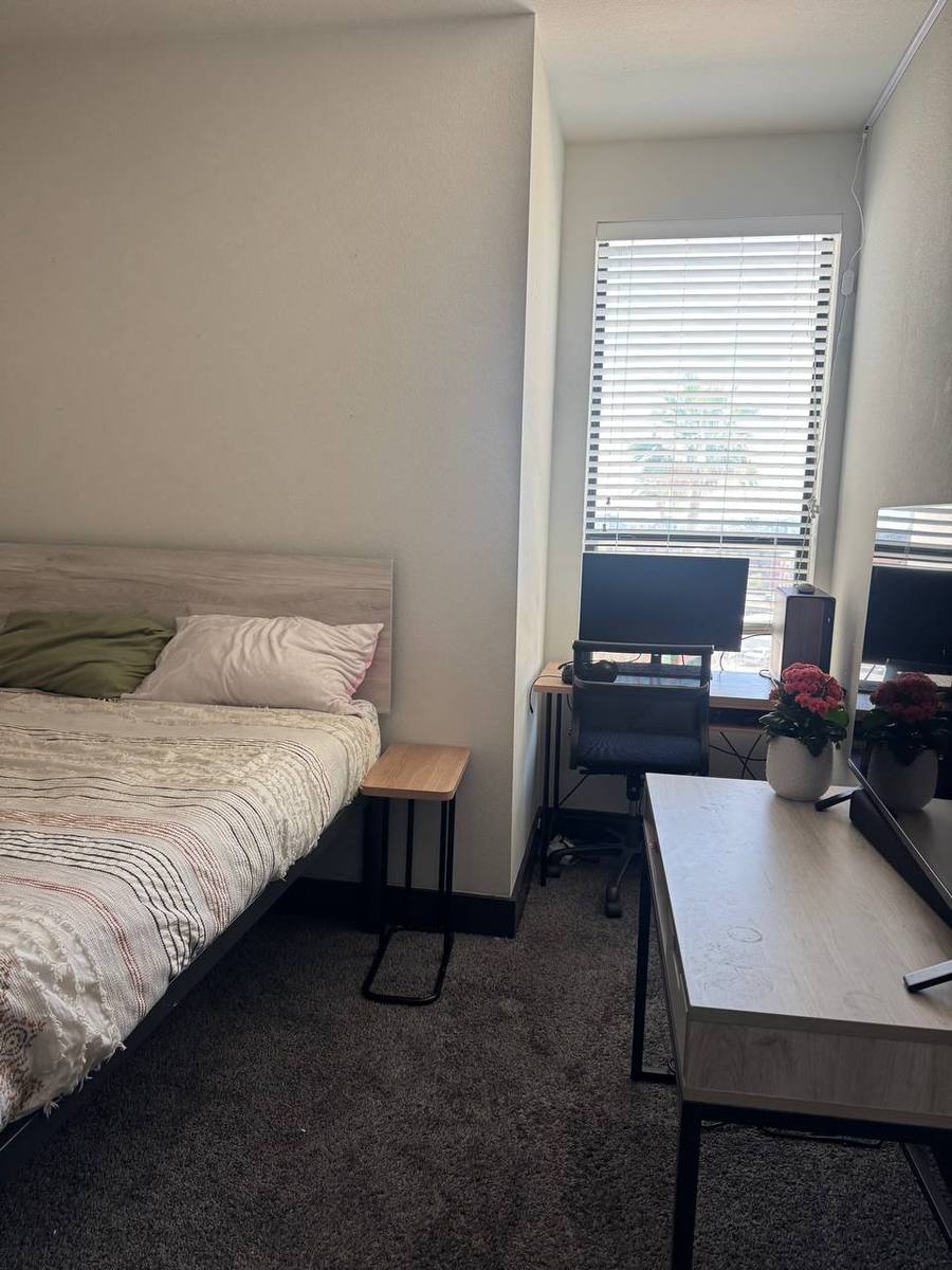 Bedroom with bed and desk area